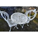 A WHITE PAINTED ALUMINIUM GARDEN TABLE WITH PIERCED FOLIATED DETAILING, 70cm diameter top and a pair