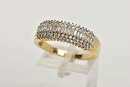 AN 18CT GOLD DIAMOND DRESS RING, set with a central row of rectangular cut diamonds, within double