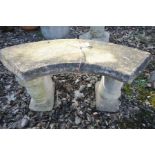 A CURVED COMPOSITE GARDEN BENCH with two squirrels supporting arch top, length 97cm