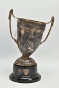 AN AF SILVER TROPHY CUP, misshapen tropy cup of a tapered form, fiited with two handles, on a