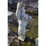 A COMPOSITE GARDEN FIGURE of a scantily clad Grecian lady carrying water ewers height 92cm