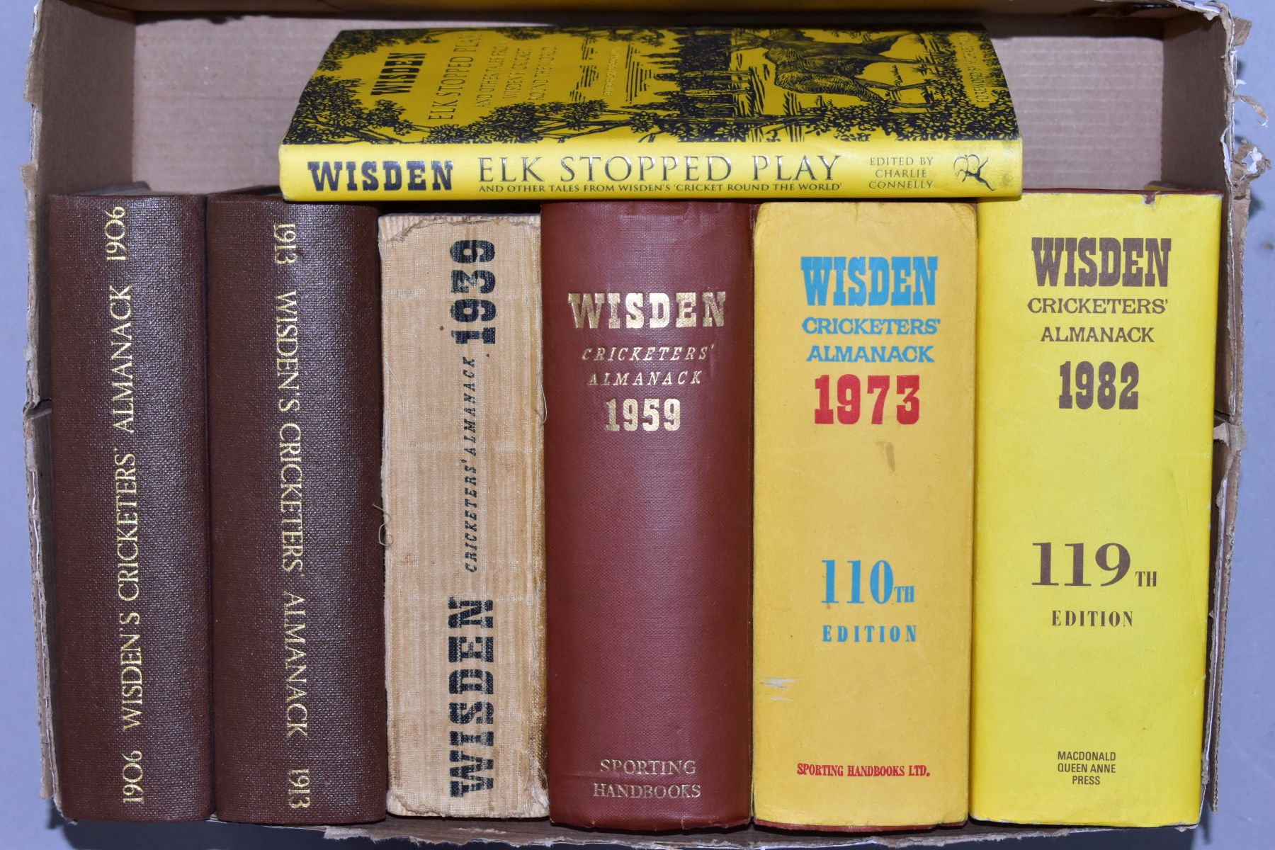 A BOX OF SEVEN WISDEN'S BOOKS, comprising Cricketer's Almanacks 1906, 1913, 1939, 1959. 1973 and