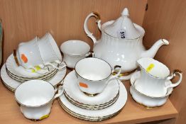 A ROYAL ALBERT VAL D'OR PART TEA SET, comprising five teacups - one chipped, six saucers and side