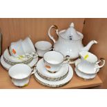 A ROYAL ALBERT VAL D'OR PART TEA SET, comprising five teacups - one chipped, six saucers and side