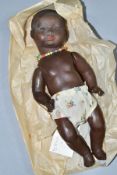 A GERMAN KB-M 1 BLACK BISQUE HEAD DOLL, composite body and bent limbs, sleeping eyes, pierced