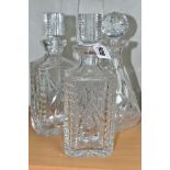 A PAIR OF WATERFORD STRAWBERRY CUT GLASS DECANTERS WITH STOPPERS, etched backstamps to the bases,