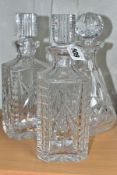 A PAIR OF WATERFORD STRAWBERRY CUT GLASS DECANTERS WITH STOPPERS, etched backstamps to the bases,