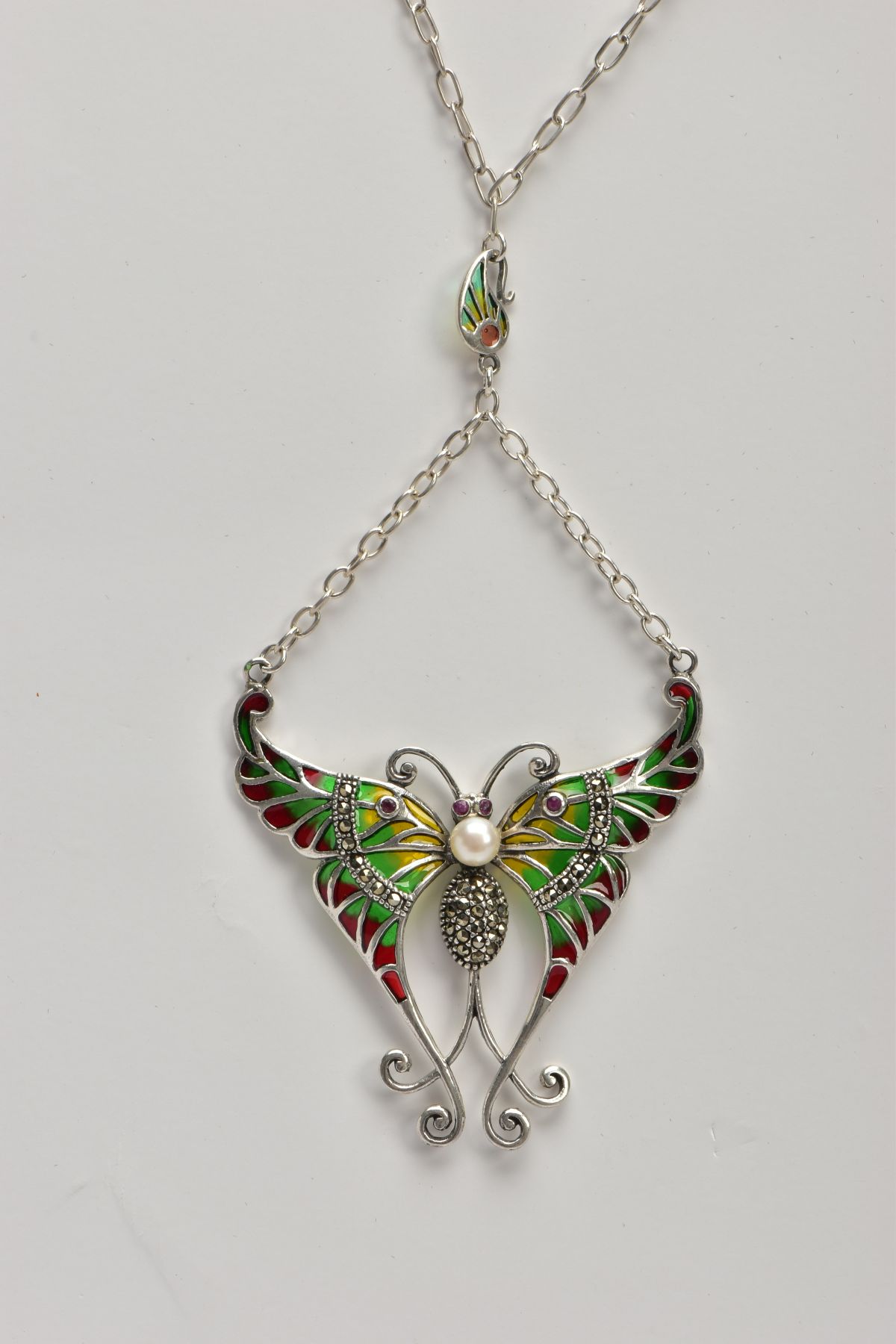 A PLIQUE A' JOUR BUTTERFLY NECKLACE, a white metal butterfly set with four circular cut rubies, a - Image 3 of 5