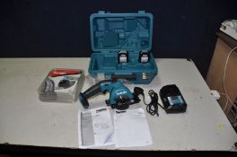 A CASED MAKITA HS301D CORDLESS CIRCULAR SAW, 10.8v with two batteries, charger and eight new and