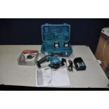 A CASED MAKITA HS301D CORDLESS CIRCULAR SAW, 10.8v with two batteries, charger and eight new and