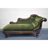 A VICTORIAN MAHOGANY CHAISE LONGUE, covered in green upholstery, on tulip legs, length 170cm