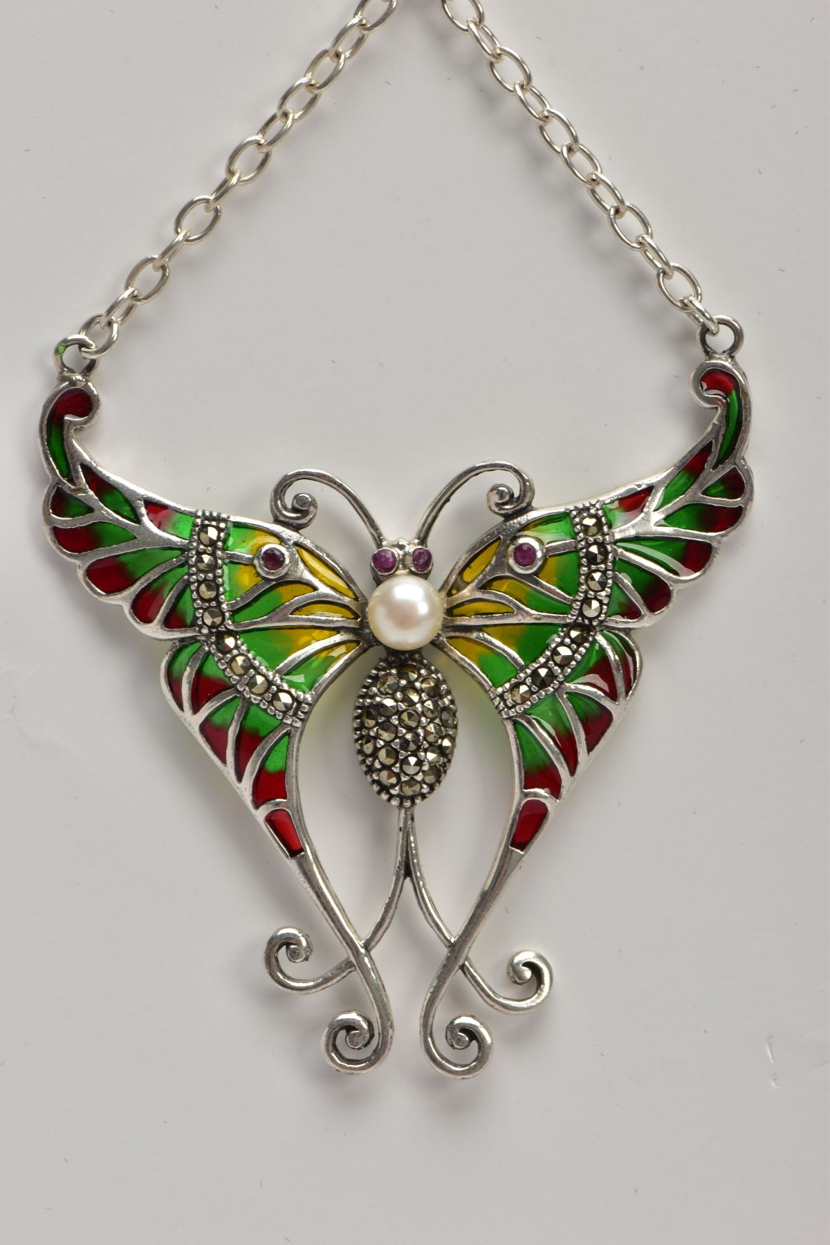 A PLIQUE A' JOUR BUTTERFLY NECKLACE, a white metal butterfly set with four circular cut rubies, a - Image 4 of 5