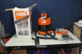 A BOXED VAX CARPET VAC/ CLEANER with attachments (PAT pass and working)