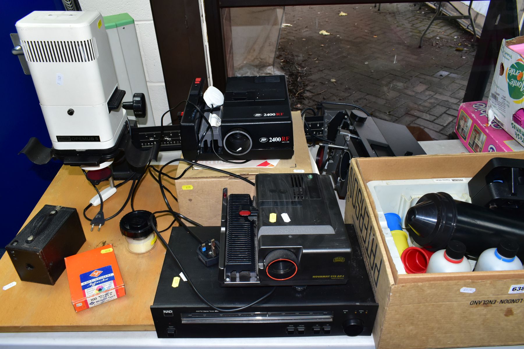 TWO BOXES AND LOOSE STEREO TUNER AND PHOTOGRAPHIC EQUIPMENT, to include a NAD AM/FM stereo tuner