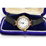 AN EARLY 20TH CENTURY 9CT GOLD WRISTWATCH, hand wound movement, round face, Arabic numberals, in a