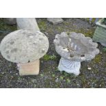 A COMPOSITE BIRD BATH IN THE FORM OF A SHELL, SUPPORTED BY A TWISTED BASE, height 47cm, and a