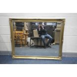 A LARGE MID TO LATE 20TH CENTUEY GILTWOOD BEVEL EDGE MIRROR, 131cm x 103cm