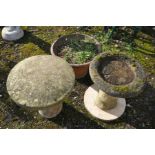 A MODERN COMPOSITE BIRDBATH in the form of a tree stump supporting a bowl height 53cm, a round slab,