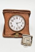 A SILVER TRAVEL CLOCK AND GOLIATH TRAVEL CLOCK, a small silver cased square travel clock, signed '