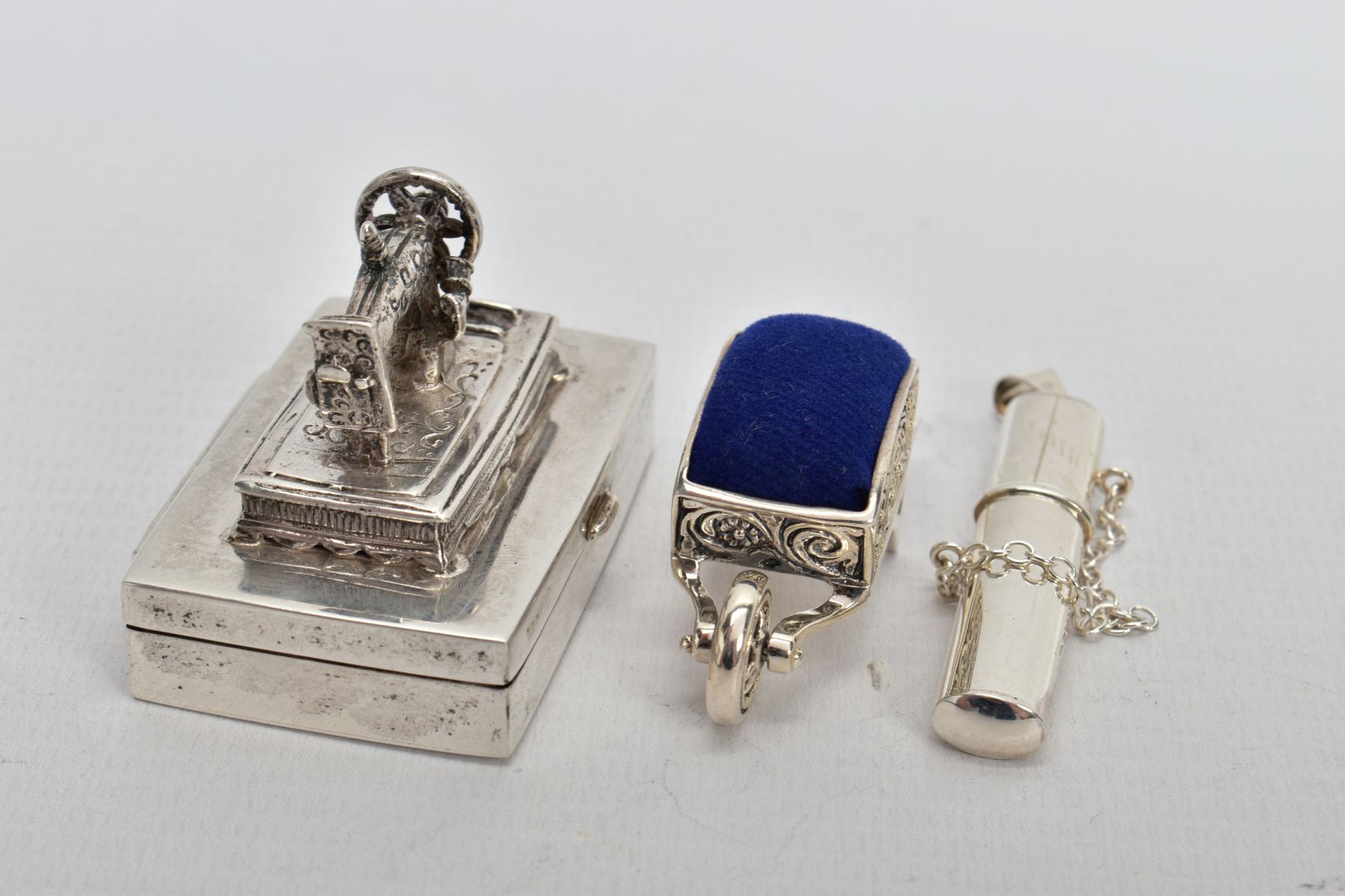 THREE WHITE METAL ITEMS, to include a silver sewing needle box fitted with a sewing machine to the - Image 2 of 5