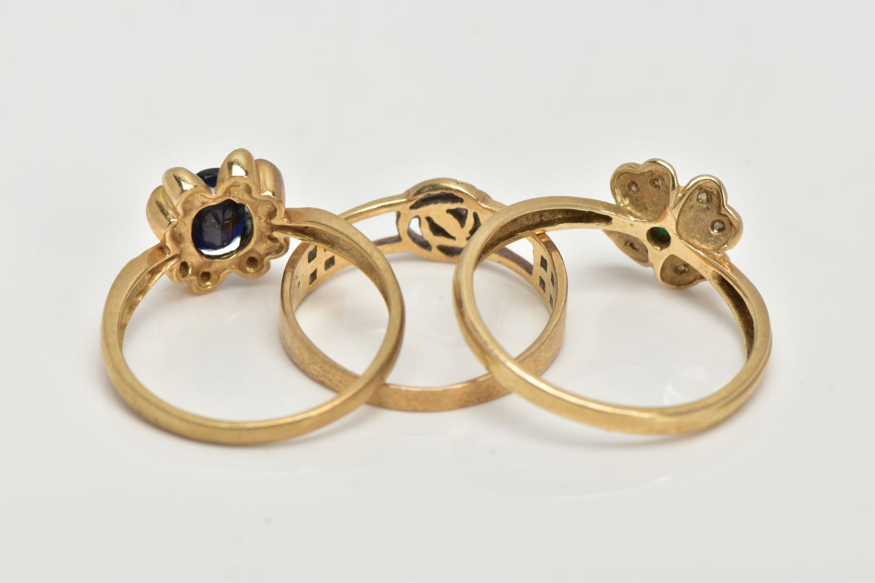 THREE 9CT GOLD RINGS, the first set with an oval cut blue sapphire, within a floral surround set - Image 3 of 3