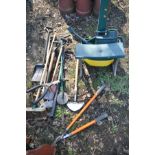 A SELECTION OF GARDEN TOOLS, to include a lawn seeder, garden kneeler with handles, brushes, shovel,