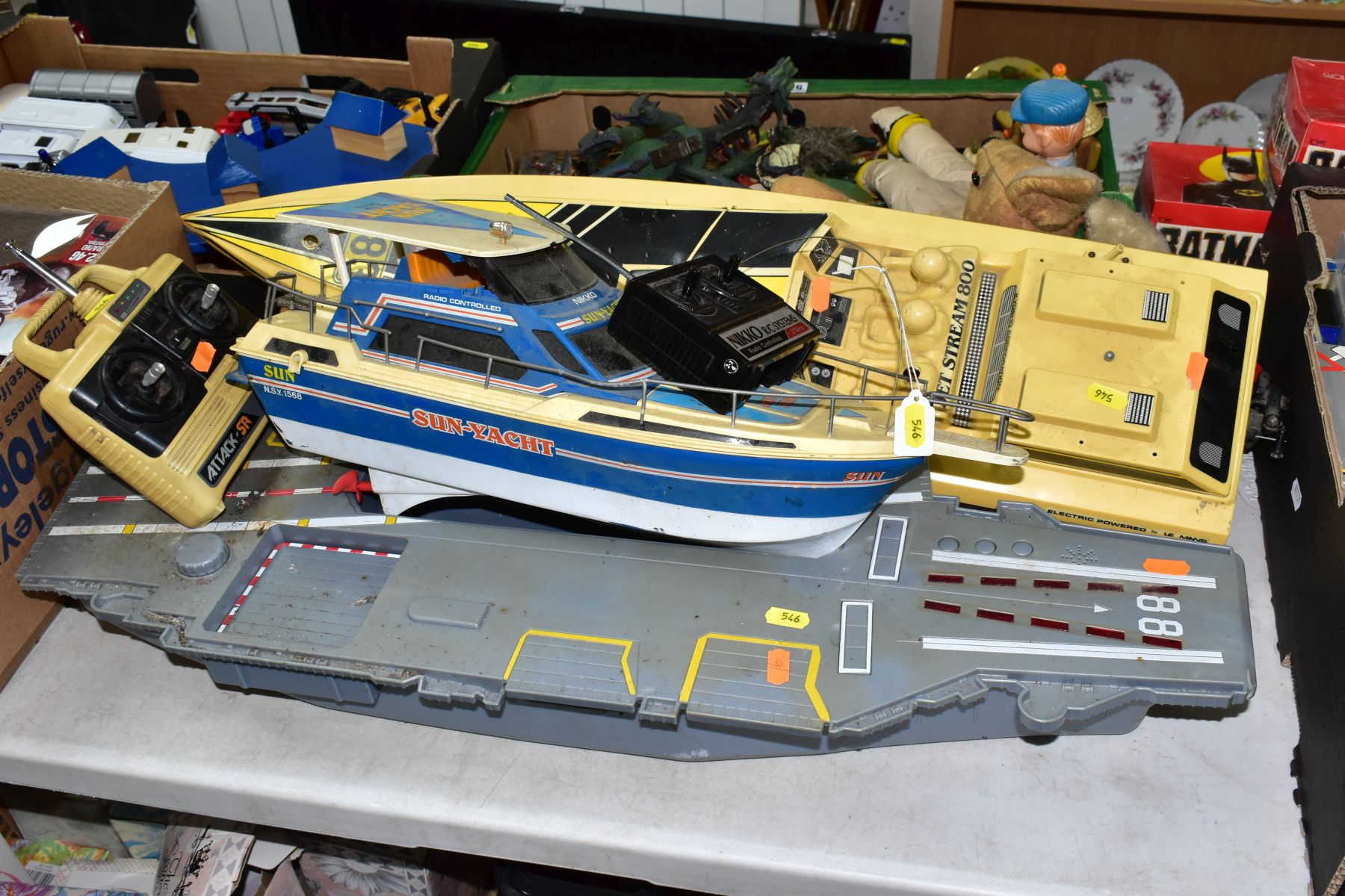 A BOX OF ASSORTED TOYS AND TWO RADIO CONTROLLED BOATS AND A BATTERY OPERATED SHIP, the toys to - Image 8 of 8