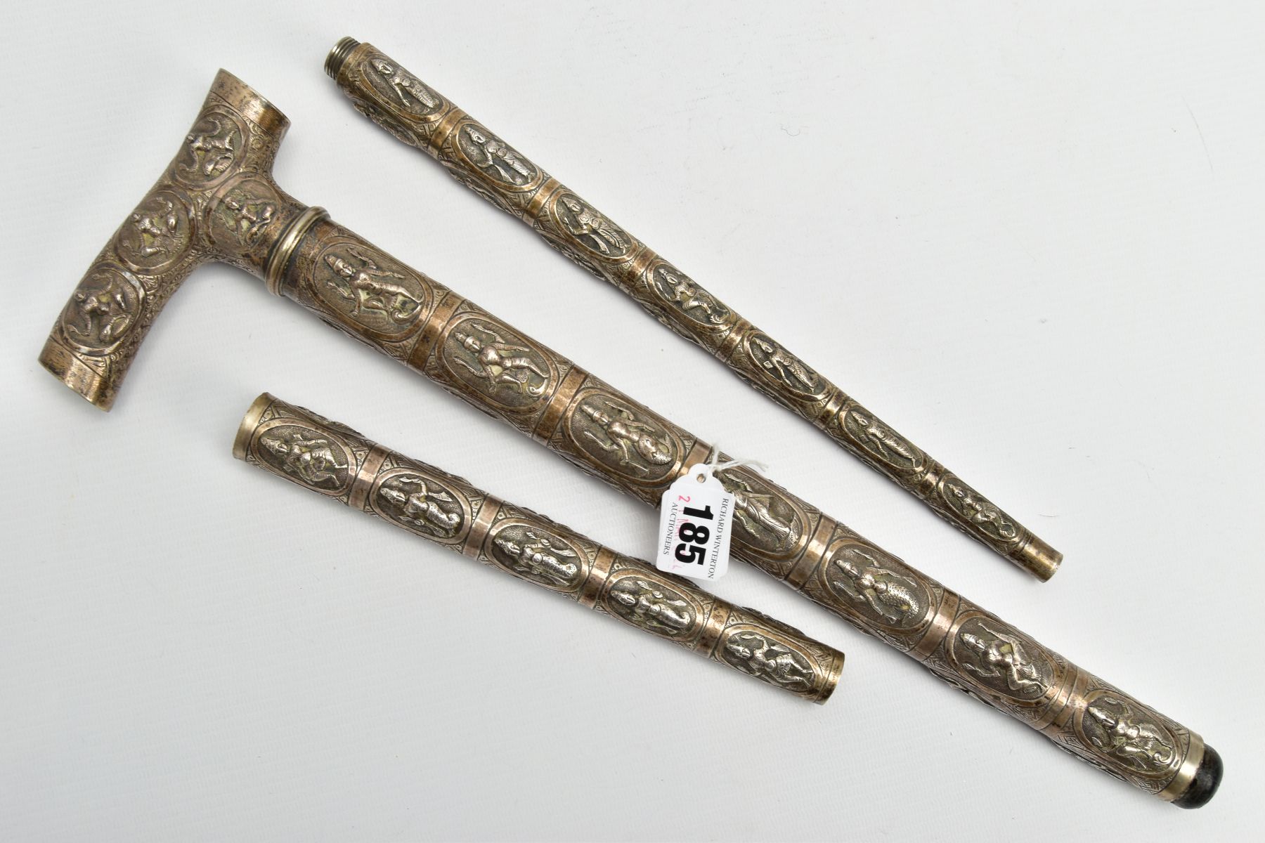 AN ASIAN WHITE METAL WALKING CANE, embossed religious figures throughout, can be taken apart into - Image 5 of 7