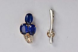 TWO PENDANTS, the first a drop pendant set with three oval cut blue stones assessed as kyanite,