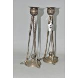 A PAIR OF WALKER AND HALL PLATED CANDLESTICKS, in the form of three golf clubs supporting a golf