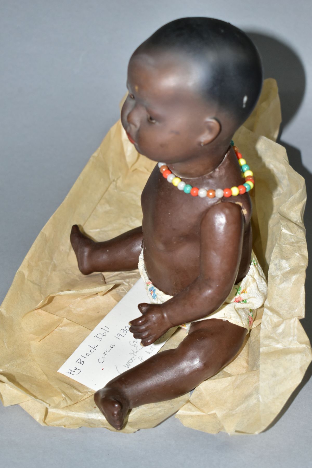 A GERMAN KB-M 1 BLACK BISQUE HEAD DOLL, composite body and bent limbs, sleeping eyes, pierced - Image 4 of 7