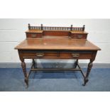 AN EDWARDIAN MAHOGANY WRITING DESK with brown leather inlay, two drawers and two gallery drawers, on