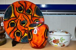 POOLE POTTERY ETC, COMPRISING A PEACOCK PATTERN CHARGER / SHALLOW DISH, approximate diameter 40cm, a