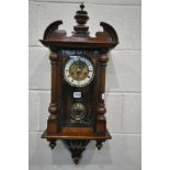 A WALNUT VIENNA WALL CLOCK, with winding key and pendulum, height 75cm