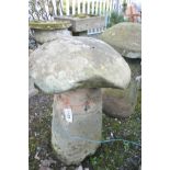 AN EARLY SANDSTONE STADDLE STONE WITH TOP, base in tapered cylindrical form, bottom of base