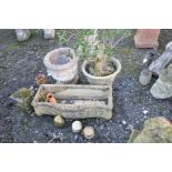 TWO COMPOSITE GARDEN PLANTERS, round in form one with a square foot, height 42cm, a rectangular