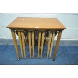 A MID CENTURY POUL HUNDEVAD TEAK NEST OF TABLES, with four circular fold out tables, width 62cm x