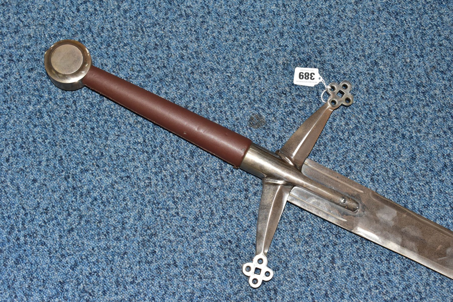 A LARGE REPRODUCTION SWORD, with leather grip, pierced cross guard, sharpened blade, length 142cm ( - Image 2 of 6