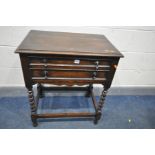 AN OAK TWO DRAWER CUTLERY CABINET, on barley twist legs united by stretchers, width 69cm x depth