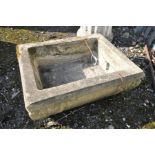 A LARGE AND VERY HEAVY RECTANGULAR GARDEN PLANTER with balustered side and foliate corner detail,