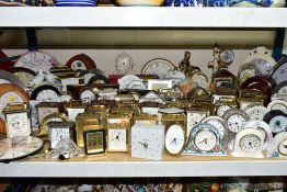 A QUANTITY OF CARRIAGE, MANTEL, ANNIVERSARY AND WALL CLOCKS, to include more than ninety, mainly