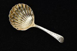 A SILVER COLOURED METAL CADDY SPOON, engraved M.G.B in memory of C.G to the front of the handle,