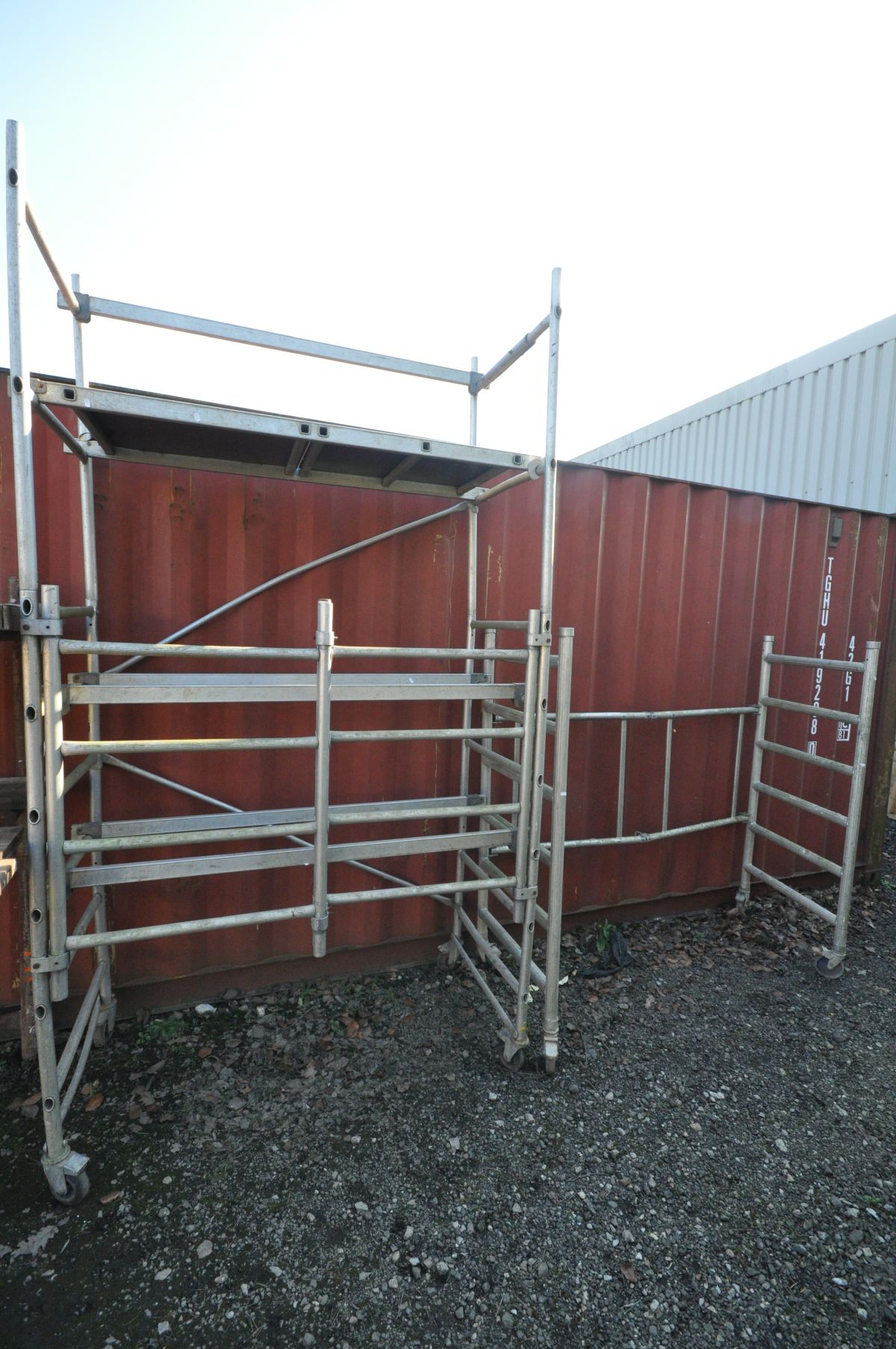 AN ALUMINIUM FOLDING AND STACKING SCAFFOLD TOWER, 160cm wide x 78cm deep x 290cm high, with two