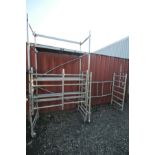 AN ALUMINIUM FOLDING AND STACKING SCAFFOLD TOWER, 160cm wide x 78cm deep x 290cm high, with two
