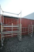 AN ALUMINIUM FOLDING AND STACKING SCAFFOLD TOWER, 160cm wide x 78cm deep x 290cm high, with two