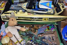 A BOX OF ASSORTED TOYS AND TWO RADIO CONTROLLED BOATS AND A BATTERY OPERATED SHIP, the toys to