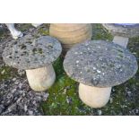 A PAIR OF MODERN COMPOSITE STADDLE STONES with tops height 59cm