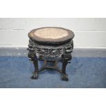 A HARDWOOD ORIENTAL JARDINERE STAND, with marble insert, carved frieze, on ball and claw feet,