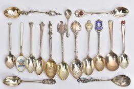 AN ASSORTMENT OF SILVER TEASPOONS, to include a white guilloche enamelled spoon signed on the