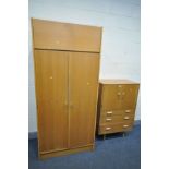 A STAG CONCORD RANGE OAK TALLBOY, the double cupboard doors over three drawers, on cylindrical legs,